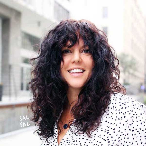 curly-hair-with-bangs-and-layers