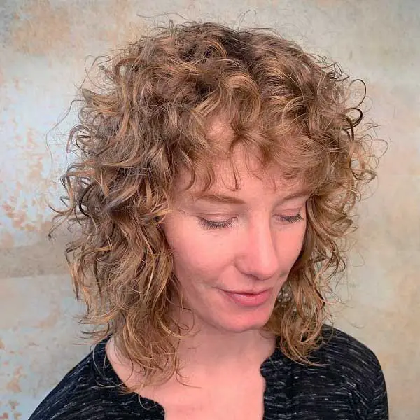 layered-curly-hair-with-bangs