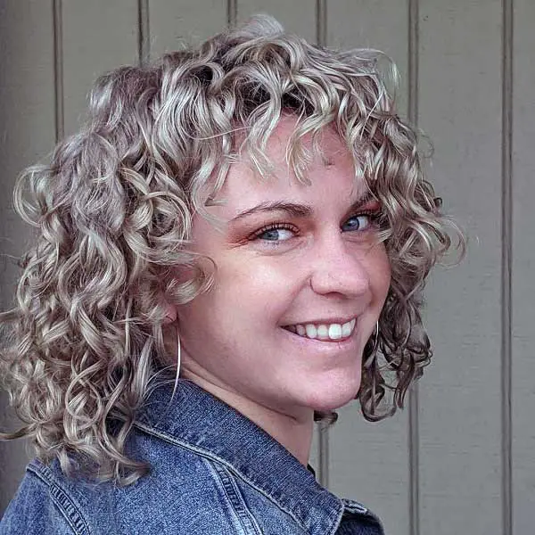 short-curly-hair-with-bangs-and-layers-polished_curls