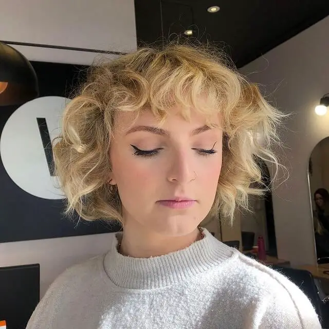 curly blonde with bangs