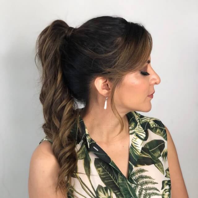 messy ponytail with side bangs 