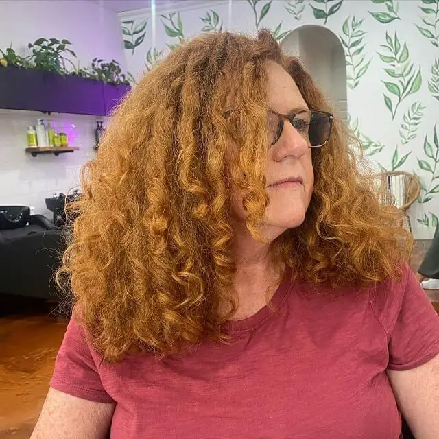 medium length curly hairstyles for women over 50 