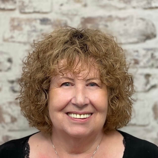 natural curly hair with highlights for women over 50 