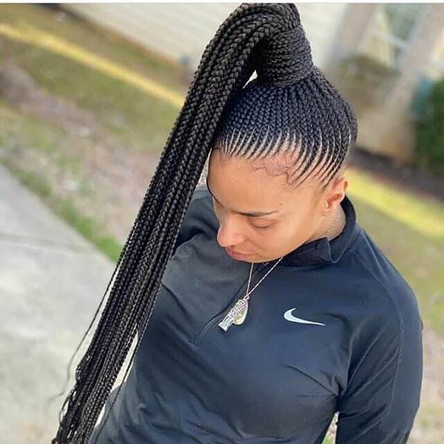 skinny feed in braids in a ponytail
