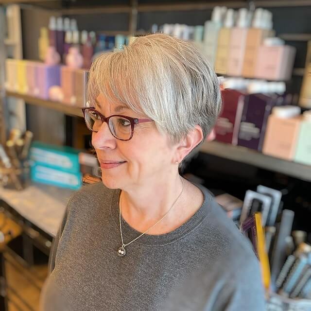 Side-swept bangs for over 50 with glasses