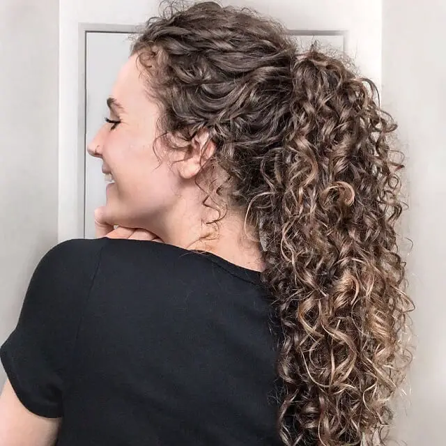 balayage on curly ponytail