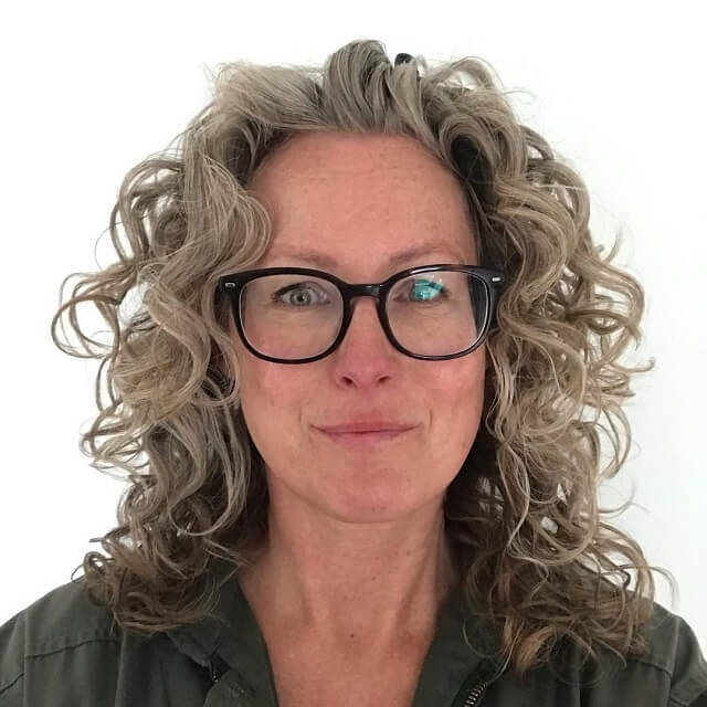 curly hairstyles for over 50 with glasses