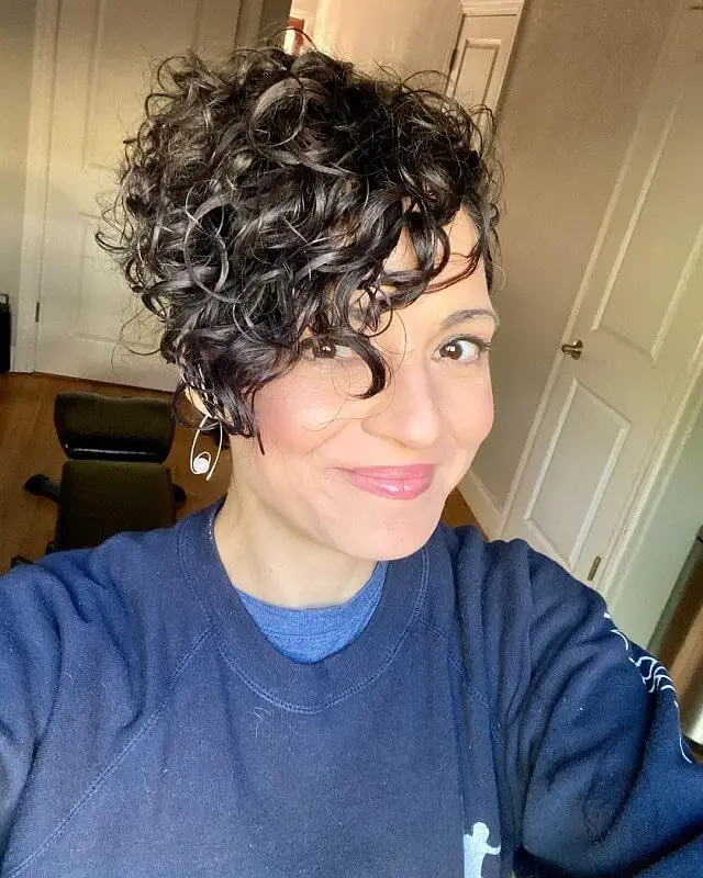 curly pixie cut with bangs