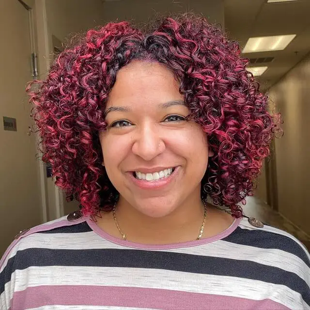 natural curly hair with red highlights