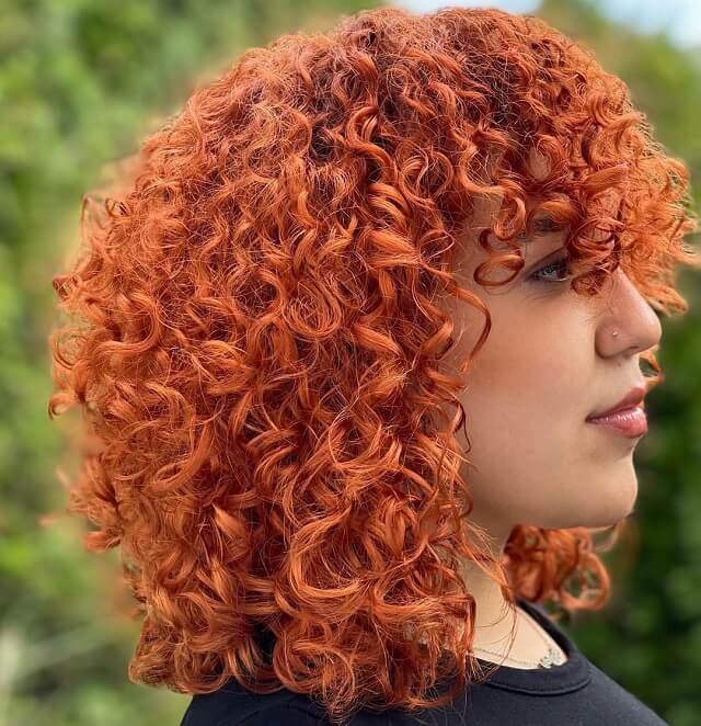 red balayage curly hair 