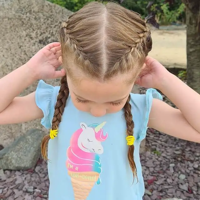  two braided ponytails little girl 