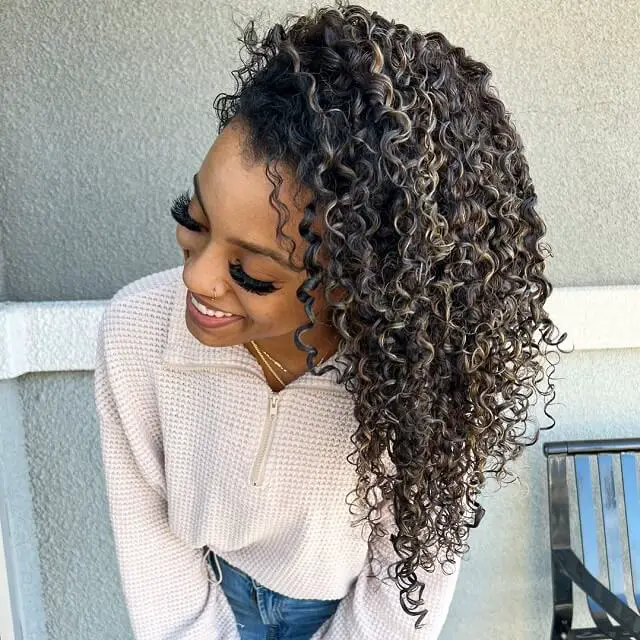  black curly hair with highlights