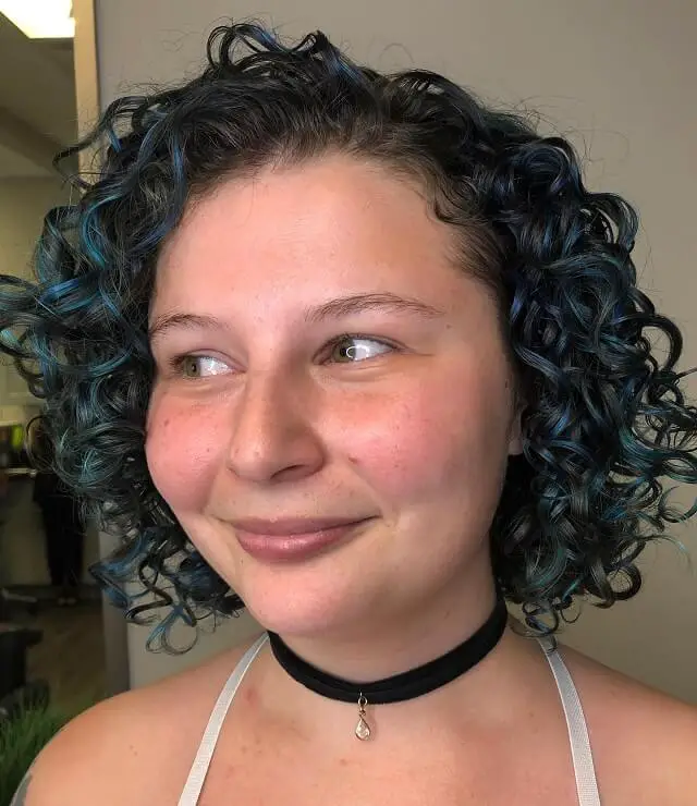 curly hair with blue highlights 