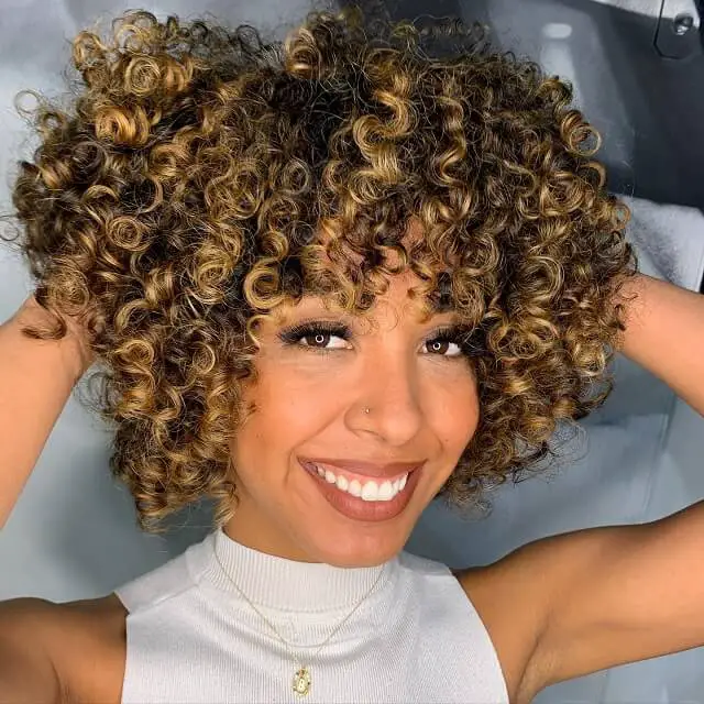 short curly hair with highlights