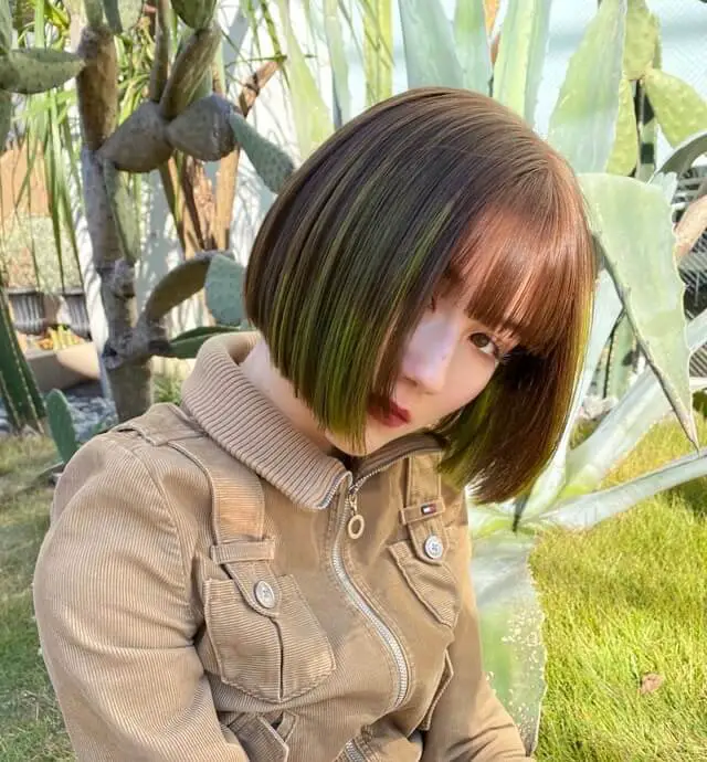 Asian hair with green highlights